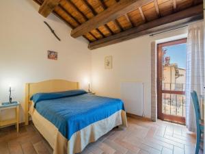 a bedroom with a bed and a large window at Holiday Home in Sellano with Pool & Sun Terrace in Sellano +32 photos