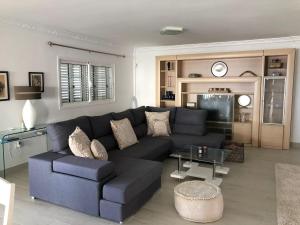 Posedenie v ubytovaní Villa Marianna con piscina climatizada y barbacoa