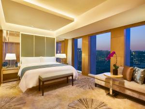 Postel nebo postele na pokoji v ubytování Pan Pacific Beijing