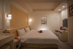 Voodi või voodid majutusasutuse Showart Hotel toas