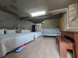 Postel nebo postele na pokoji v ubytování Quinbi Ocean View B&B