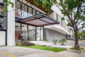 a building with awning on the side of it at Beautiful room well located in the hotel zone of Cancun in Cancún