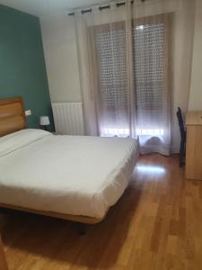Posteľ alebo postele v izbe v ubytovaní Hostal Rural 18 de Abril