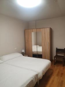 Posteľ alebo postele v izbe v ubytovaní Hostal Rural 18 de Abril