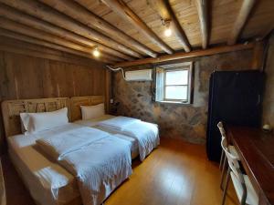 Postel nebo postele na pokoji v ubytování Quinbi Ocean View B&B