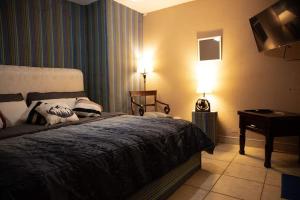 Un pat sau paturi într-o cameră la Casa MiMá