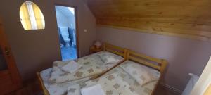 Postel nebo postele na pokoji v ubytování Sóhegy Panzió