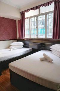 Llit o llits en una habitació de Hang Fung Hostel