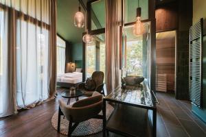 Area soggiorno di Floris Green Suites by Parc Hotel Florian