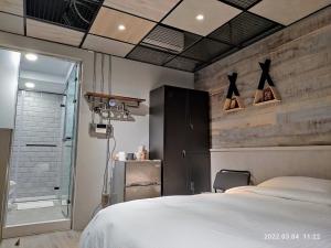 Letto o letti in una camera di 18世紀普魯士藍現代寓所Prussian Blue Inn原愛迪亞旅社