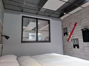 Letto o letti in una camera di 18世紀普魯士藍現代寓所Prussian Blue Inn原愛迪亞旅社