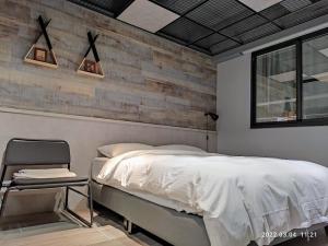 Letto o letti in una camera di 18世紀普魯士藍現代寓所Prussian Blue Inn原愛迪亞旅社