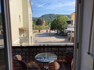 a view from a balcony with a table and chairs at Gästehaus Flair in Mettlach