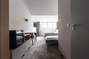 Postel nebo postele na pokoji v ubytování OPERA Hotel