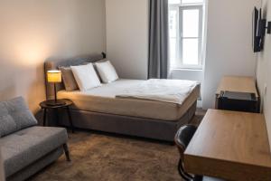 Postel nebo postele na pokoji v ubytování OPERA Hotel