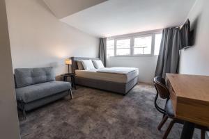 Predel za sedenje v nastanitvi OPERA Hotel