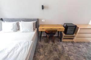 Postel nebo postele na pokoji v ubytování OPERA Hotel