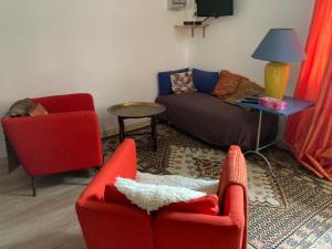 a living room with two chairs and a couch at Essentiel Barret in Barret-sur-Meouge