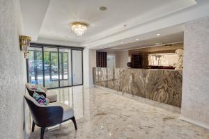 a lobby with a bar and a chair and a counter at Montenegrina Hotel & SPA All-Inclusive in Becici