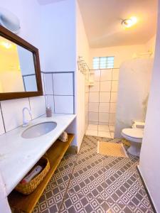 Koupelna v ubytování Ôxe Uai Hostel