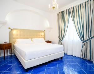 מיטה או מיטות בחדר ב-La Casa di Paolo Casa di Charme