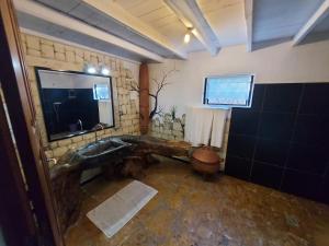a bathroom with a sink and a toilet at La Bella Donna in Ifaty