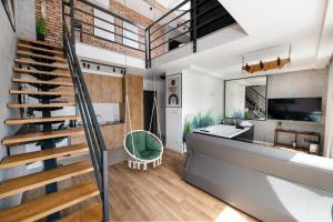 a bathroom with a staircase and a sink at Relaxroom Szmaragd in Reda