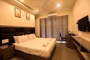 Postel nebo postele na pokoji v ubytování Coastal Pearl Hotel Miramar Panaji + 22 fotografií