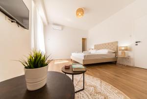 Posteľ alebo postele v izbe v ubytovaní Central Seaside Residence
