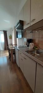 Kjøkken eller kjøkkenkrok på Apartments ALTO