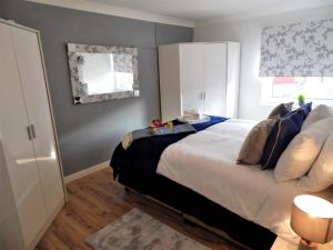 Łóżko lub łóżka w pokoju w obiekcie Signature Apartments - Stanfield House