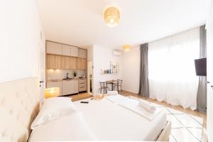 Posteľ alebo postele v izbe v ubytovaní Central Seaside Residence