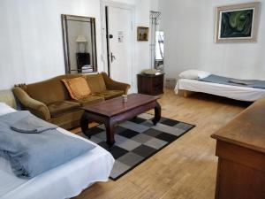 a living room with a couch and a coffee table at Guesthouse Copenhagen in Copenhagen