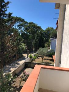 a view from the balcony of a house with a bench at La Terrazza sul Mare in Sellia Marina +10 photos