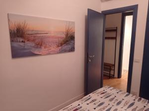 Ένα ή περισσότερα κρεβάτια σε δωμάτιο στο Casa degli Ulivi