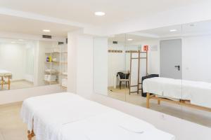 A bed or beds in a room at Hotel Olympus Palace