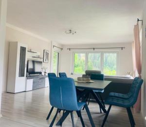 TV a/nebo společenská místnost v ubytování Ferienhaus Lara
