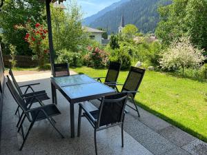 a table and chairs sitting on a patio at Ferienhaus Lara in Feld am See