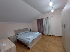 Ein Bett oder Betten in einem Zimmer der Unterkunft Zartonq
