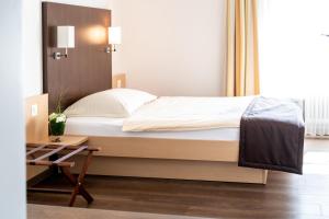 Postel nebo postele na pokoji v ubytování Hotel zum goldenen Kreuz