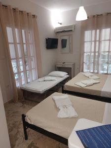 Postel nebo postele na pokoji v ubytování AK VILLAGE ROOMS