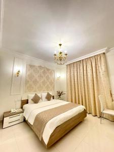 Ένα ή περισσότερα κρεβάτια σε δωμάτιο στο A'Sinamar Hotel Apartment