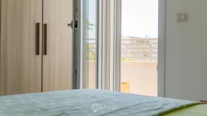 Postel nebo postele na pokoji v ubytování Cozy Apartment Alghero