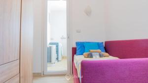 Postel nebo postele na pokoji v ubytování Cozy Apartment Alghero