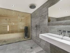 a bathroom with a sink and a shower at Chalet moderne à Méribel avec jacuzzi et sauna - FR-1-566-30 in Les Allues +6 photos