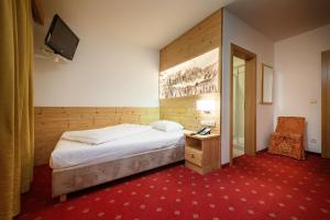 Postel nebo postele na pokoji v ubytování Hotel Ronce