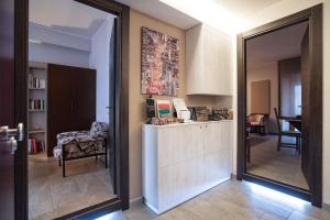 a kitchen with a counter and a refrigerator in a room at Guest House Al Centro Storico in Barletta