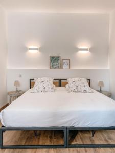 Letto o letti in una camera di Hotel Savel