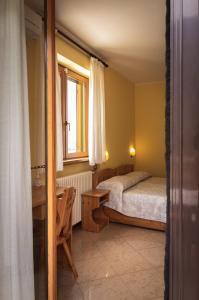 A bed or beds in a room at Agriturismo la campagnola