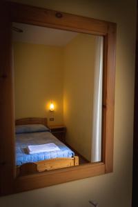 A bed or beds in a room at Agriturismo la campagnola